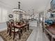 Elegant dining area with sophisticated lighting and classic wooden furniture at 501 Tamiami N Trl # 502, Venice, FL 34285
