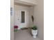 The inviting condo entrance with decorative details and charming curb appeal adds a warm welcome at 501 Tamiami N Trl # 502, Venice, FL 34285