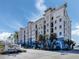 Stunning waterfront condo building features architectural details, lush landscaping and beautiful Port Vista signage at 501 Tamiami N Trl # 502, Venice, FL 34285