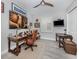 A home office featuring a wooden desk, leather chair, and stylish decor with neutral walls and a light wood floor at 501 Tamiami N Trl # 502, Venice, FL 34285