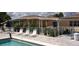 Relaxing pool area with comfortable lounge chairs, perfect for soaking up the sun and enjoying the community at 530 Walnut Cir, Venice, FL 34285