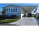 Well-maintained home with covered parking and landscaped front yard at 530 Walnut Cir, Venice, FL 34285