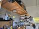 Workshop with pegboard and overhead loft space for storage at 530 Walnut Cir, Venice, FL 34285