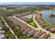 Aerial view of a residential community with homes surrounding lakes and lush landscaping at 5665 Piccolo St, Nokomis, FL 34275