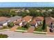 Neighborhood aerial view of the community showcasing mature landscaping, green lawns, and tile roofs at 5665 Piccolo St, Nokomis, FL 34275