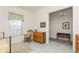 Bright and airy bedroom with light tile flooring, a comfy bed and a warm ambiance at 5665 Piccolo St, Nokomis, FL 34275