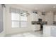 Bright kitchen with stainless steel appliances, white cabinets, and breakfast nook with lots of natural light at 5665 Piccolo St, Nokomis, FL 34275