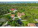 High angle view showing the home, circular driveway, and proximity to water at 5694 Hale Rd, Venice, FL 34293