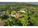 Aerial shot of expansive property with large private lot, bonus garage, and luscious green trees at 5694 Hale Rd, Venice, FL 34293