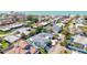Stunning aerial view of beach house with pool and outdoor seating in a desirable coastal neighborhood at 605 Cornwell On The Gulf, Venice, FL 34285