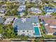 This home boasts a private pool, modern patio and a sleek roof design in a desirable neighborhood at 605 Cornwell On The Gulf, Venice, FL 34285