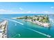 Beautiful aerial view of the waterfront area with boats under a sunny sky at 605 Cornwell On The Gulf, Venice, FL 34285