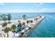 Stunning aerial view featuring a beachside building, a pier, and waterfront scenery at 605 Cornwell On The Gulf, Venice, FL 34285