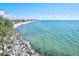 Scenic aerial view of a coastal area with trees and waterfront condominiums at 605 Cornwell On The Gulf, Venice, FL 34285