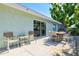 Backyard featuring a patio with an outdoor dining area, perfect for enjoying meals al fresco at 605 Cornwell On The Gulf, Venice, FL 34285