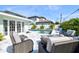 Backyard with refreshing pool and comfortable lounge seating, creating an inviting outdoor retreat at 605 Cornwell On The Gulf, Venice, FL 34285