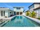 Backyard featuring a sleek pool that enhances the appeal of this home at 605 Cornwell On The Gulf, Venice, FL 34285