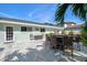 Backyard patio with elegant outdoor dining area, ideal for entertaining at 605 Cornwell On The Gulf, Venice, FL 34285