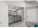 Elegant bathroom featuring dual sinks, granite countertops, and a large mirror at 605 Cornwell On The Gulf, Venice, FL 34285