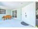 Inviting front entrance with double doors, bench seating, and decorative architectural details at 605 Cornwell On The Gulf, Venice, FL 34285