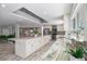 Bright kitchen with a large island, ample counter space, and modern appliances at 605 Cornwell On The Gulf, Venice, FL 34285
