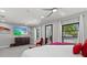 Bright main bedroom with large windows, ceiling fan, and neutral color palette at 605 Cornwell On The Gulf, Venice, FL 34285