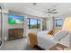 Bright main bedroom with large windows and view of the Florida landscape at 605 Cornwell On The Gulf, Venice, FL 34285