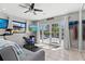 Bright workout room with French doors, fitness equipment, and a view of the backyard at 605 Cornwell On The Gulf, Venice, FL 34285