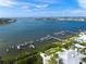 Stunning aerial view showcasing waterfront location and boat dock, providing direct access to open water at 746 Eagle Point Dr, Venice, FL 34285