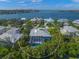 Aerial view of a house with screened in lanai and backyard pool at 746 Eagle Point Dr, Venice, FL 34285
