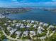 Beautiful aerial showcases the coastal community, water access and manicured landscaping at 746 Eagle Point Dr, Venice, FL 34285