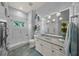 Charming bathroom with a glass shower and a vanity with good storage space at 746 Eagle Point Dr, Venice, FL 34285