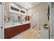 Elegant bathroom with dual sinks, a large mirror, and a separate shower at 746 Eagle Point Dr, Venice, FL 34285