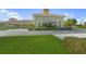 Attractive community center featuring mature landscaping, convenient parking and a welcoming covered entrance at 746 Eagle Point Dr, Venice, FL 34285
