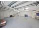 Spacious three car garage with epoxy flooring, ample storage and lots of room for customization at 746 Eagle Point Dr, Venice, FL 34285