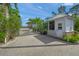 Private community gate with lush tropical landscaping at 746 Eagle Point Dr, Venice, FL 34285