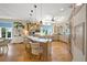 Spacious kitchen with an island and breakfast bar, ample cabinetry, and hardwood flooring at 746 Eagle Point Dr, Venice, FL 34285