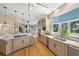 Well-lit kitchen with marble countertops and stainless steel appliances at 746 Eagle Point Dr, Venice, FL 34285