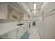Functional laundry room with ample storage, white cabinetry, and modern appliances at 746 Eagle Point Dr, Venice, FL 34285