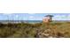 Quaint lifeguard tower overlooking the dunes and serene beach at Venice, Florida at 746 Eagle Point Dr, Venice, FL 34285