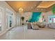 Spacious living room with a decorative feature wall and wood paneled ceiling at 746 Eagle Point Dr, Venice, FL 34285
