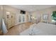 Spacious main bedroom featuring hardwood floors and access to an outdoor balcony at 746 Eagle Point Dr, Venice, FL 34285
