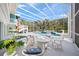 Large screened pool with spa, surrounded by ample seating and lush tropical landscaping at 746 Eagle Point Dr, Venice, FL 34285