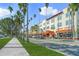 Charming street view of businesses and restaurants under palm trees offering a vibrant retail and dining experience at 746 Eagle Point Dr, Venice, FL 34285