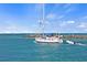 Beautiful sailboat sailing toward the jetty at the Venice Beach inlet at 746 Eagle Point Dr, Venice, FL 34285