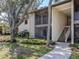 Two story condo featuring screened patios and verdant landscaping offers a tranquil living experience at 748 White Pine Tree Rd # 208, Venice, FL 34285