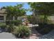 Lush landscaping and water feature enhance the community's beauty at 748 White Pine Tree Rd # 208, Venice, FL 34285