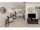 Bright living room showcasing neutral tones, cozy seating, and stylish decor at 748 White Pine Tree Rd # 208, Venice, FL 34285