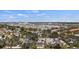 Charming neighborhood with lush trees, well-maintained homes and a view of city and amenities in the distance at 888 Guild Dr, Venice, FL 34285