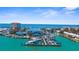Lovely aerial view features a well-maintained marina with neatly docked boats and stunning oceanfront property at 888 Guild Dr, Venice, FL 34285